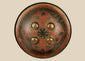 Small circular Indo-Persian Dhal shield, 11 inches diameter, lacquered black and red with damascened foliate motifs, four raised bosses, interior grips with knuckle-guard cushion, well-preserved antique.