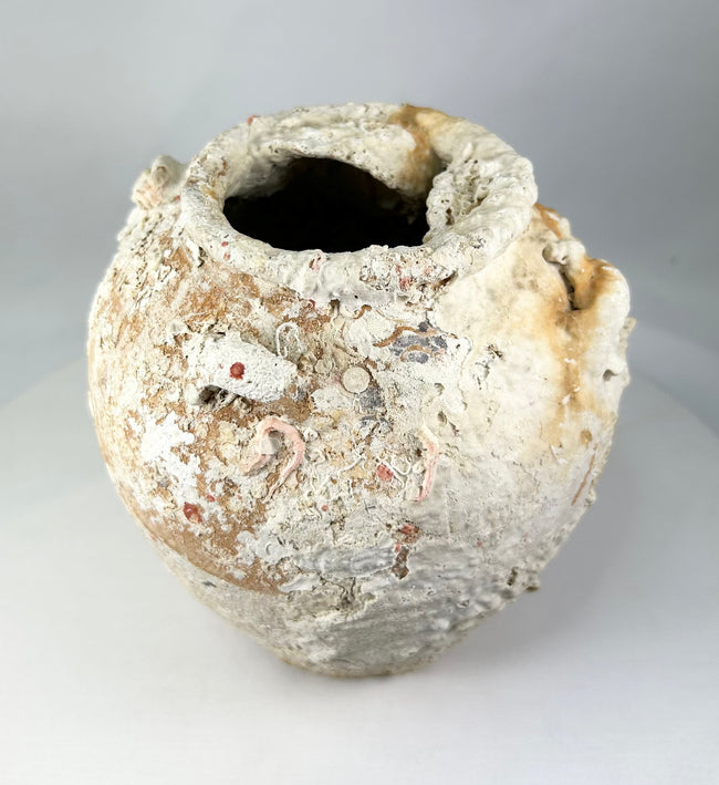 Ancient Song Dynasty storage jar from Southeast Asian shipwreck, terracotta with thick marine deposits and rounded body