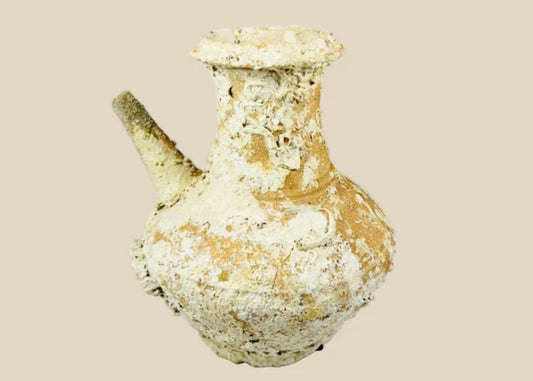 Song Dynasty Chinese terracotta wine pot with marine encrustations, recovered from a shipwreck near Balabac Island, featuring a wide mouth, rounded body, and slender spout, reflecting ancient maritime trade and centuries underwater.