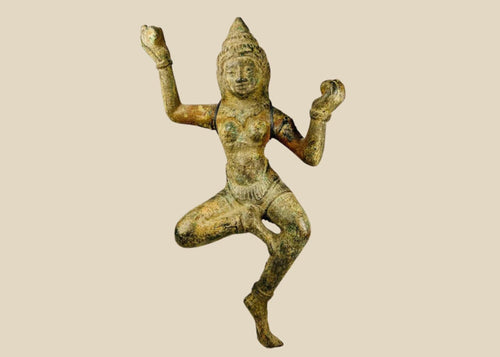 Bronze South Asian sculpture of a dancing deity, likely a Devata or Apsara, with ornate headpiece, flowing attire, and natural green patina, circa 12th–18th century CE.