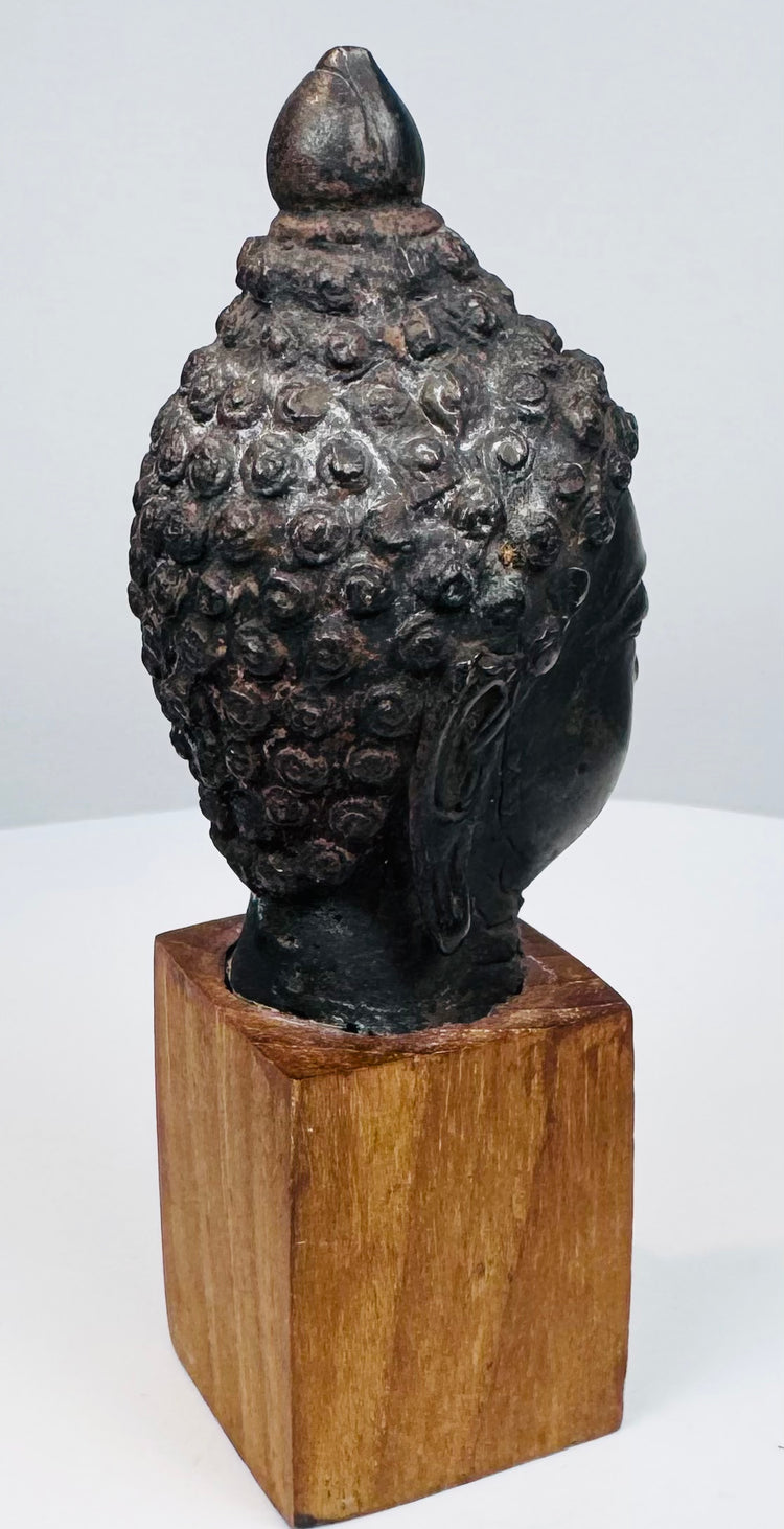 18th–19th century Thai or Burmese Buddha head with intricately modeled curls and dark patina