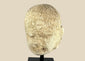 Southeast Asian carved stone Buddha head with serene expression and closed eyes, 13th–14th century, mounted on a modern black stand, Burma or Thailand.