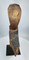 Southeast Asian spiritual hardwood carving mounted on a metal stand with aged patina