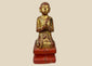 Hand-carved Burmese wooden monk statue, 18th–19th century, with gold leaf and red lacquer, kneeling in prayerful devotion.