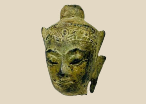 Fragmentary cast bronze Buddha head with serene expression, arched brows, closed eyes, subtle smile, and engraved crown band; traces of gilt and lacquer; likely Thailand or Burma, Late Ayutthaya–Early Rattanakosin or Toungoo–Konbaung period, circa 15th–18th century CE; mounted on a custom acrylic stand.