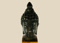 Antique Southeast Asian cast bronze Buddha head, likely from Thailand or Burma, 18th–19th Century CE. Features serene facial expression, closed eyes, gentle smile, ushnisha symbolizing wisdom, and intricately modeled hair curls. Dark natural patina with wooden base, reflecting Theravāda Buddhist devotional artistry and meditation iconography.