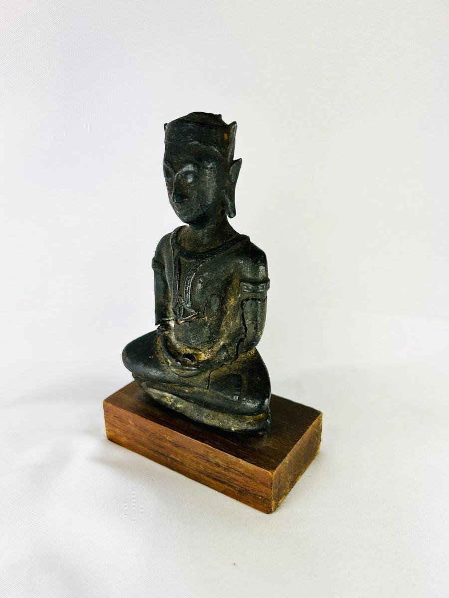 Small 18th–19th century Southeast Asian cast bronze Buddha statue in meditative pose with serene expression and headdress, mounted on a wooden base, 5.5 x 2 x 3.25 inches, Thailand or Burma.