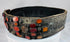 Close-up of orange Cornelian gemstones set into an ornate Jewish bridal belt dating to the 17th–18th century.