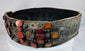 Close-up of orange Cornelian gemstones set into an ornate Jewish bridal belt dating to the 17th–18th century.