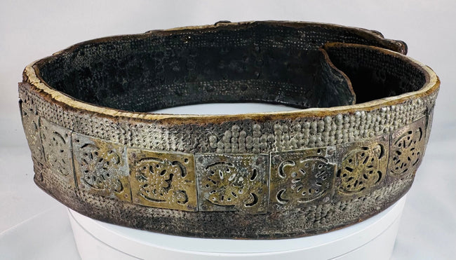 Historic Southern Russian wedding belt displaying repeating geometric brass elements and polished orange Cornelian cabochons.