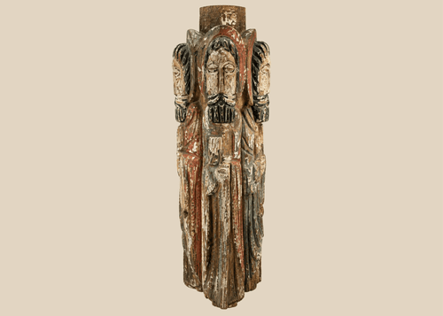 Spanish Colonial carved wooden column with four haloed saint figures and traces of polychrome paint.