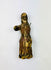 Close-up of a carved wooden santo highlighting polychrome paint remnants and hand-carved details