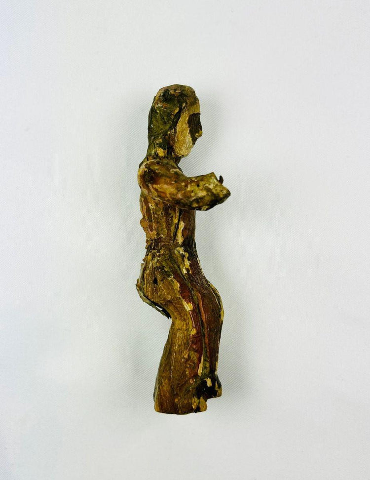 17th-century Spanish Colonial devotional santo carved in wood, showing aged surface and religious detailing