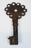 Small Spanish colonial skeleton key with pierced head, defined shank, and centuries-old surface oxidation.