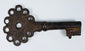 Historic colonial iron key likely used for a chest, door, or secure storage during the Spanish Empire.