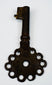 Early colonial forged iron key from the Spanish Americas with simple functional design and authentic aged wear.
