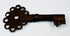 Antique Spanish Empire key forged from iron, featuring a compact form, pierced bow, and aged patina.