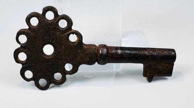 16th–18th century Spanish iron key showing a pierced handle, compact bit, and naturally developed antique patina.