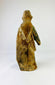 Antique European or Spanish Colonial wooden saint figure with flowing robes, weathered surface, and authentic age wear