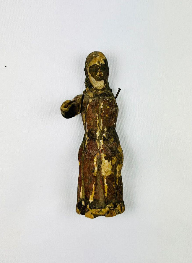 Spanish Colonial carved wooden santo sculpture with remnants of original polychrome paint, 17th century