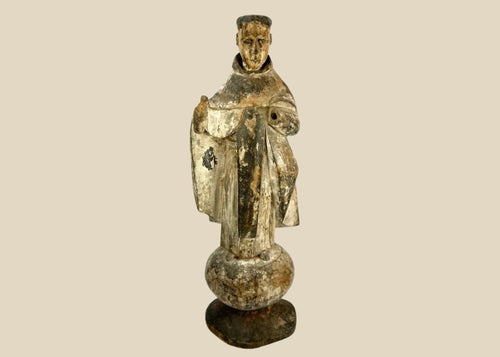 Antique Spanish Colonial santo figure from Latin America (Mexico or Peru), 17th–18th century, carved wood with remnants of polychrome and gesso, depicting a friar or monk in a robe, mounted on an integral rounded base, photographed on a white background.