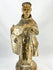 Spanish Colonial carved wooden santo figure depicting a friar with traces of original polychrome, 17th–18th century.