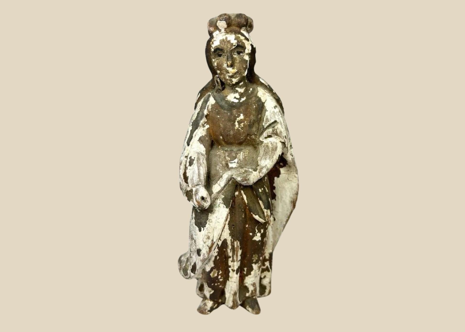 Antique Spanish Colonial Santo statue, hand-carved from wood with remnants of polychrome paint, depicting a robed religious figure with folded hands, traditional hairstyle, and worn surface patina, dating to the 18th–19th century, used for devotional practices in colonial-era Catholic households.