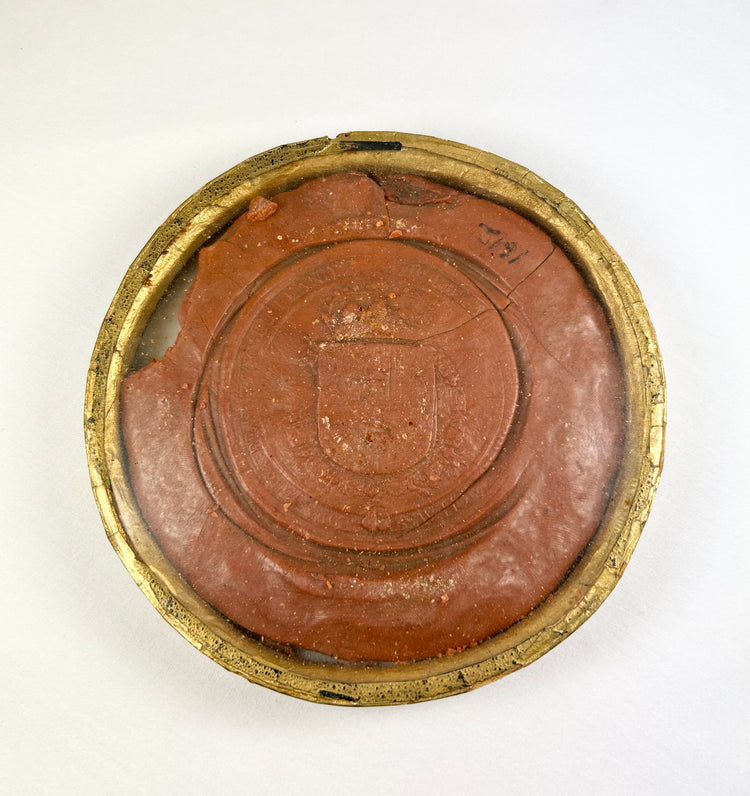 Red wax royal seal of King Philip IV of Spain, circular with detailed enthroned monarch design and Latin inscription, mounted on a white background.