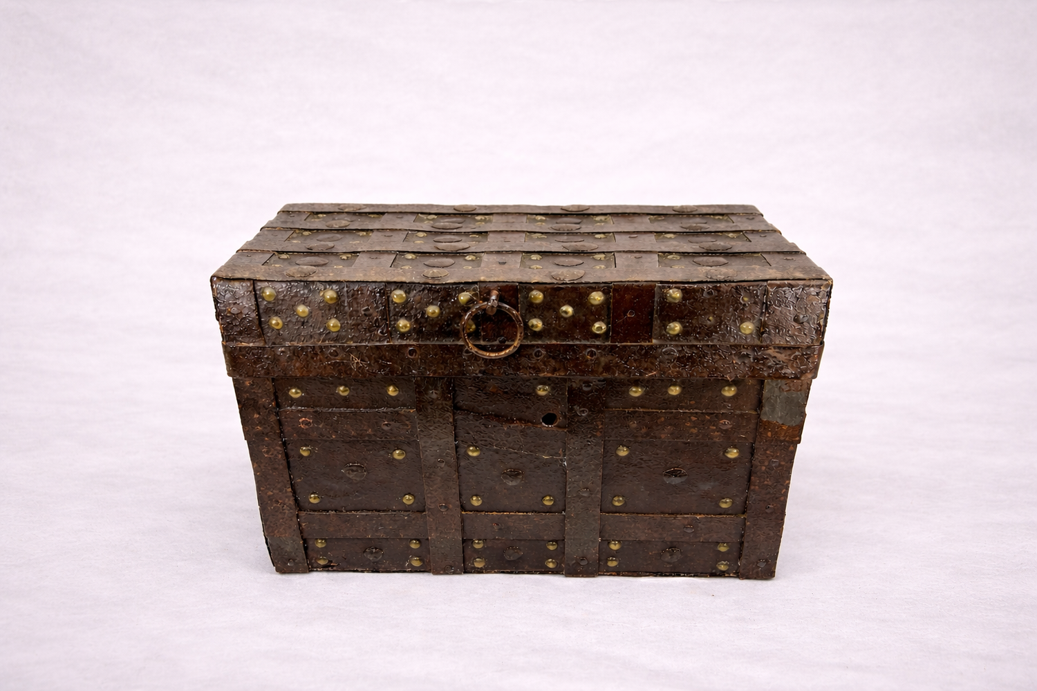 Open iron-bound wooden strongbox with riveted metal bands and aged interior, Spanish or Portuguese style treasure chest in the 16th–17th century style