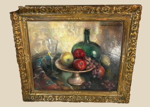 Early 20th-century American oil on canvas still life by John Hubbard Rich, depicting apples, grapes, a wine bottle, and goblet in a giltwood frame, photographed against a white background.