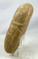 Rustic stone guardian figure with strong sculpted features and patina