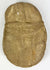 Boldly carved stone face effigy with warrior symbolism and patina