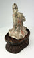 Tang Dynasty terracotta court musician with traces of red and white pigments