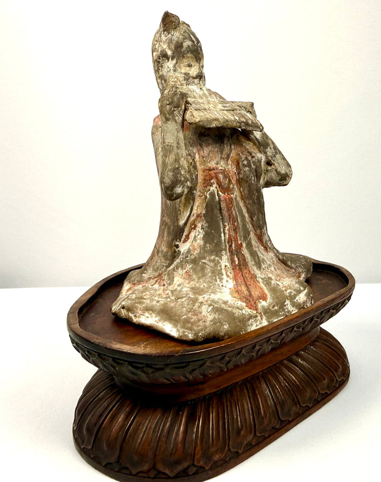 Side profile aged terracotta figurine musician on carved wooden stand