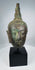 Sukhothai Period Buddha head with downcast eyes and elongated earlobes