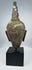 Ancient Thai Buddhist bronze sculpture with brown, red and green patination