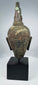 Ancient Thai Buddhist bronze sculpture with brown, red and green patination