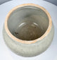 Antique Si Satchanalai stoneware vessel with sculptural fitted cover, applied scroll decoration, and crackled glaze.