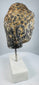 Southeast Asian Buddhist stone sculpture with serene face, aged patina and pigment traces