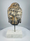 Antique Southeast Asian carved stone Buddha head with traces of pigment, 18th–19th century
