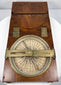 Open Thomas Jones surveying instrument with one brass alidade arm extending across the silvered compass dial.