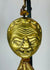 Himalayan gilt bronze ritual mask pendant with textile tassels