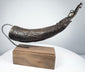 Historic Himalayan ritual horn from Tibet showing intricate surface carving, elongated snout, and ceremonial craftsmanship.