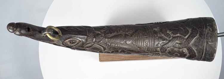 Authentic Tibetan ritual horn from the Himalayan region, carved with symbolic details and used in purification ceremonies.