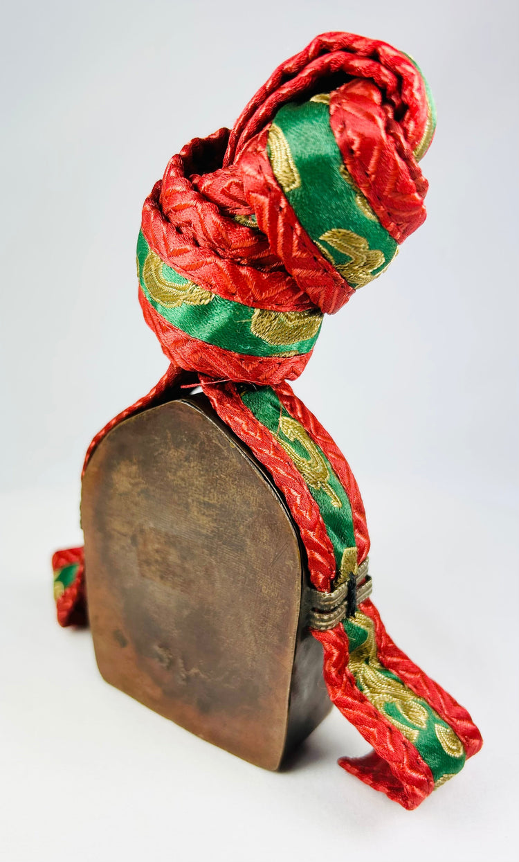 Tibetan Buddhist gau amulet shrine with brass repoussé details and colorful handwoven strap