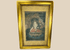 Tibetan Buddhist silk painting of seated figure with halo in ornate frame