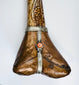 Decorative terminal of antique Tibetan kangling showing fitted metalwork and naturally aged human bone