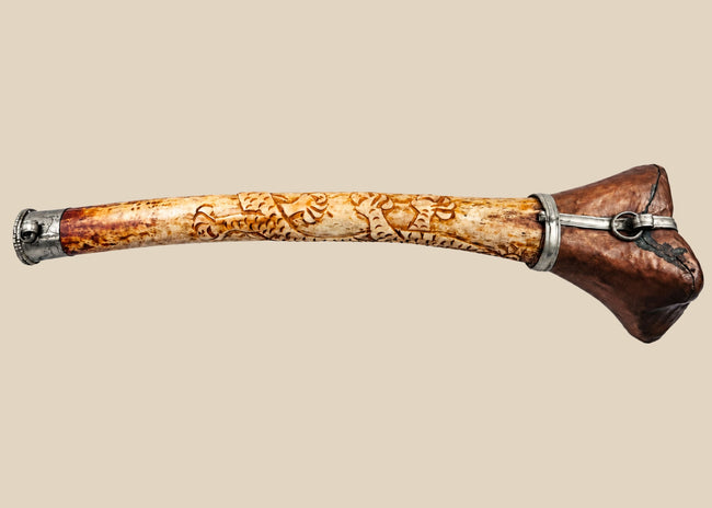 Antique Tibetan kangling ritual trumpet made from human femur bone with carved dragon decoration and metal fittings