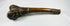 Full-length side view of Tibetan kangling showing the curved human femur shaft and decorated terminal fittings