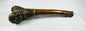 Full-length side view of Tibetan kangling showing the curved human femur shaft and decorated terminal fittings